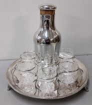 A Walker and Hall silver plated and glass cocktail set with a cocktail shaker six engraved glasses