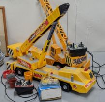 A Tonka 3201 Super Crane Truck with operating remote, together with a similar one and other items