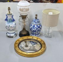 A late 19th century/early 20th century oil lamp, together with two Chinese style lamps and one other