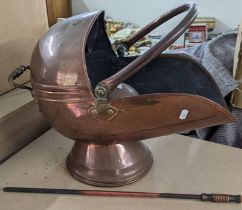 A Victorian copper helmet shaped coal scuttle with fire poker Location:LWF