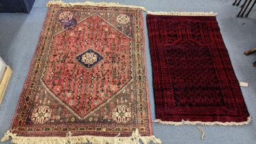Two rugs to include an Afghan Baluch rug, 127cm x 78cm, and a Persian rug having tree and animal