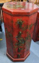 A late 20th century oriental style chest with black lacquered, bird and floral ornament on a