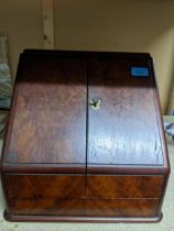 A Victorian burr walnut stationary box, two hinged front above a drawer, revealing fitted