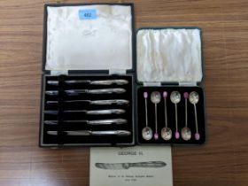 A cased set of six silver coffee bean spoons with pink coloured finials, Sheffield 1932, maker James