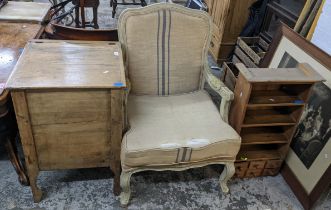 A mid 20th century French style armchair together with a pine wall hanging rack and a pine storage