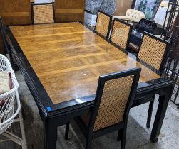 An Oriental style black ebonized and burr elm extending dining table and a matching set of six