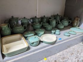 A quantity of Denby green glazed table ware to include teapots, coffee pots, covered soup bowls