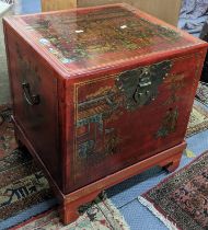 A late 20th century oriental red lacquered chest with a hinged top, decorated with figures, 57cm h x