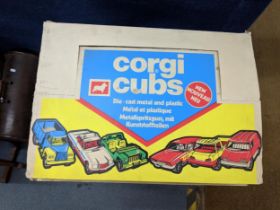 A Corgi Toys cub shop counter trade box No. 51043 containing twelve green and yellow jeeps no.