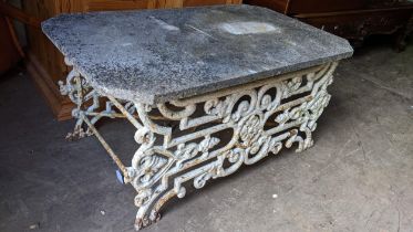 A late 19th/early 20th century white painted low cast iron table with an octagonal marble top,