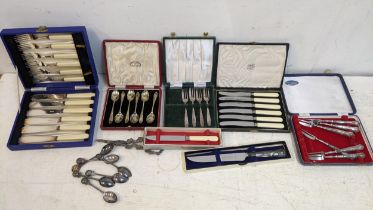 Silver plated cutlery and flatware to include gape scissors, fish knives and forks, teaspoons and