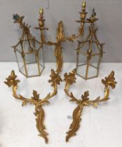 Three 20th century brass twin branch wall lights, and a pair of brass centre lights Location: A3B