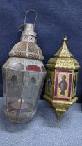 Two Moroccan style pierced metal hanging lanterns with inset coloured glass panels Location:RWB
