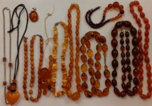 A quantity of vintage amber (5) and amber effect (3) bead necklaces to include a faceted amber