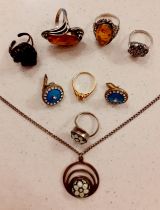 Two silver and amber Modernist rings, a silver marcasite ring, a silver pendant with micro-mosaic