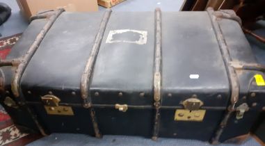 An early 20th Century steamer trunk having treen strapwork and leather reinforced corners with