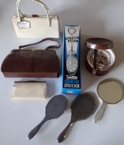 A mixed lot comprising a mid 20th Century Mappin & Webb brown snakeskin handbag, a 1950's cream