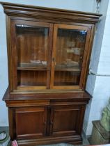 A Wills & Gambier mixed wood side cabinet bookcase, twin glazed display doors with adjustable