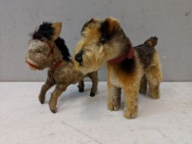 A 1950's Steiff Terry Airdale terrier dog, 17cm high, and a toy donkey with moveable back legs
