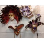 Five Venetian ornate masquerade masks, several stamped Venezia to the reverse.