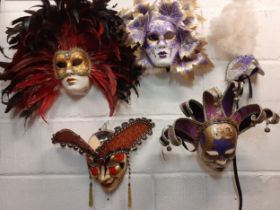 Five Venetian ornate masquerade masks, several stamped Venezia to the reverse.