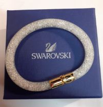 Swarovski- A modern 'Stardust' bracelet with gold tone catch, size Medium (20cm wrist width