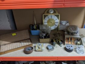 A selection of clock and watch parts to include a box of watch glasses Location: