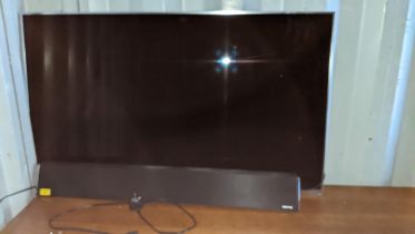 A Panasonic 50" television and sound bar Location: CON