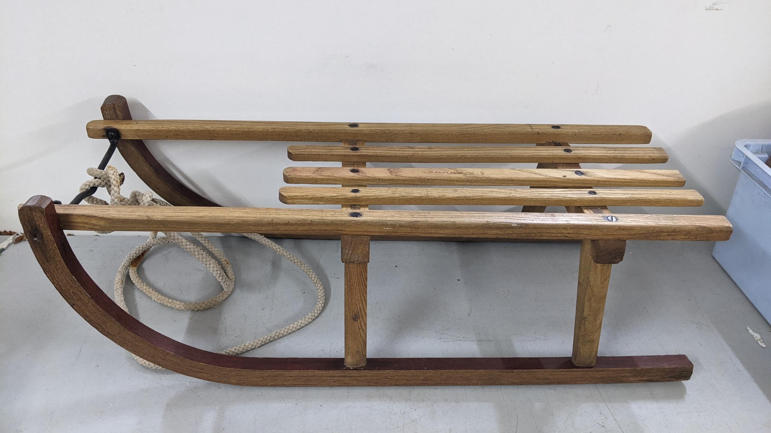 A vintage bentwood Scandinavian sledge with rope Location: