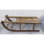 A vintage bentwood Scandinavian sledge with rope Location: