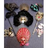 A quantity of Venetian masquerade masks and wall ornaments, to include 2 hand-held masks.