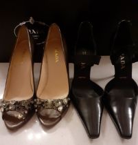 Prada- Two pairs of shoes comprising a pair of black leather 'D'Orsay' high heel shoes with semi-