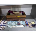 A leather case containing Masonic aprons, and various medals to include a silver WMSS Prize medal, a