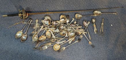 A selection of mixed silver plated flatware to include forks, spoons, scissors, and others, along