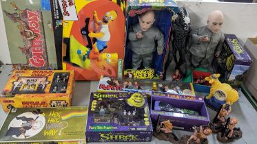 A mixed lot to include The Simpsons, Scalextric, Mambo The Invisible Donkey clock, Shrek figures,