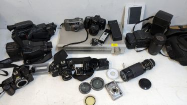Photographic equipment to include Ricoh Kr10, Nikon F401s, Sony radio Minolta 500si Location: