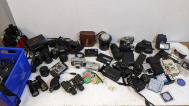 Photographic equipment and binoculars to include Prinz, Minolta 300si, Nikon Sigma lens and others