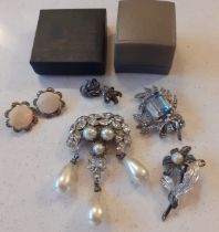 A small group of early to mid 20th Century white metal and silver costume jewellery to include a