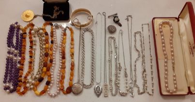 A quantity of 20th Century costume jewellery to include 3 x 1950's-70's short amber necklaces, an