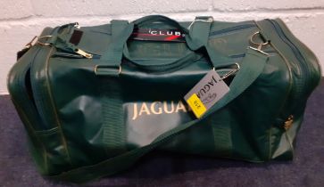 A Jaguar green sports/cabin bag, 22" long x 9" high x 9" deep.