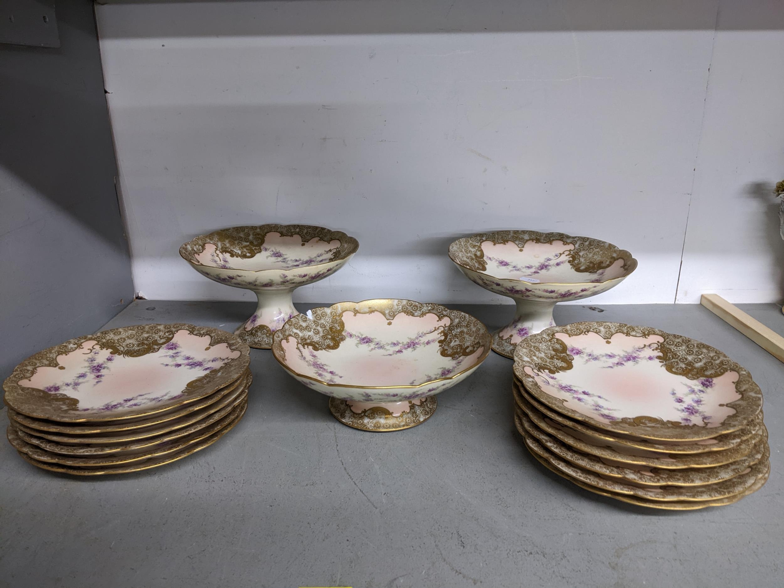 Late 19th/early 20th century Limoges porcelain dessert service decorated with flowers comprising
