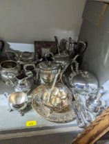 A selection of silver plate to include Victorian teapots, a photograph frame, and other items