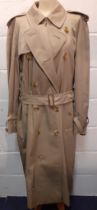 Burberrys-A 1990's unisex beige double-breasted cotton-gaberdine trench coat having a brown tartan