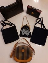 A small group of vintage bags to include a 1980's Fendi shoulder bag with striped design canvas
