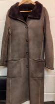 Nicole Fahri-A greyish brown sheepskin shearling coat 40" chest x 45" long having 2 front deep