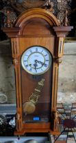 A Highlands mahogany card regulator wall clock, white enamelled roman dial marked Highlands,