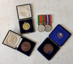 Two WWII service medals, along with two medallions from the Liverpool Institute, and a WWI Victory