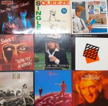 A quantity of mainly 1970's and 1980's LP's to include Rush, Sweet, Soft Cell and Rod Stewart.