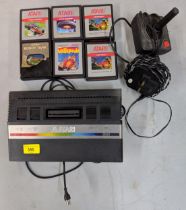 A boxed Atari video computer system 2600 with six games, Robot Tank, Millipede, Centipede 1987,