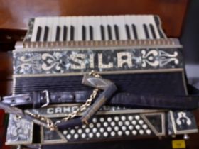 A Sila of Camerano, Italy piano accordion in case having 34 keys and 48 buttons in a black finish.